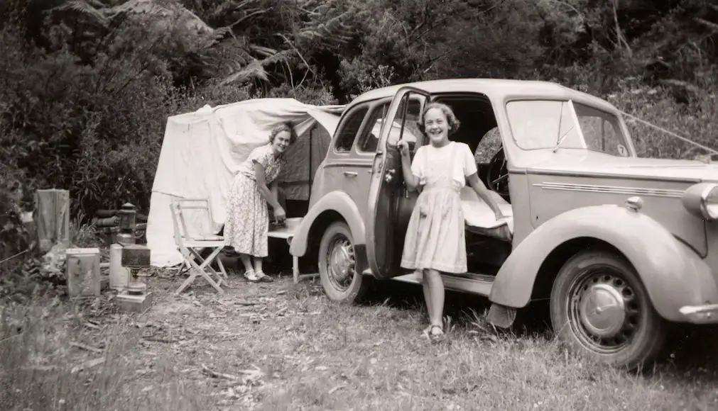 Historical black and white photograph showing early visitors at Wallowa Lake
